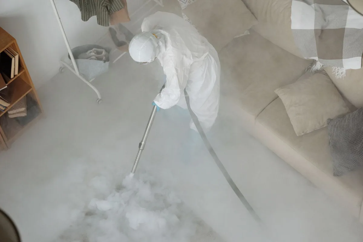 Biohazard cleanup technician in protective equipment, Cross Plains, WI